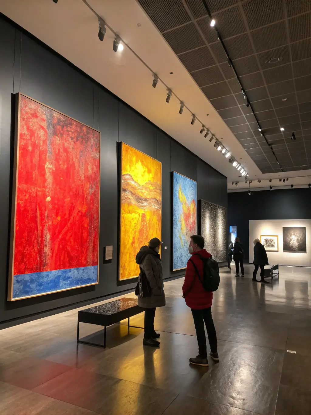 A photograph of an artist exhibiting their work at a gallery opening, highlighting MUSIKAIROS's support for visual artists.